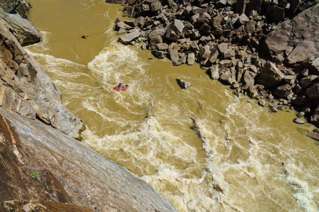 A packrafter leads the charge into Skull on Westwater Canyon of the Colorado River.