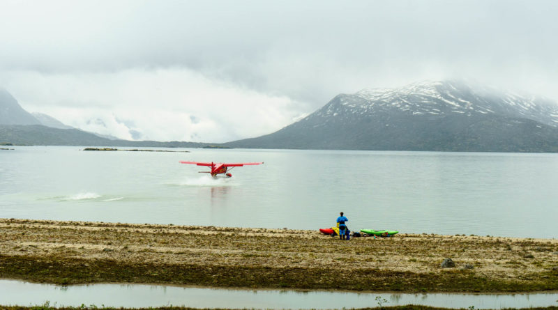Malkolm Boothroyd watches the float plane land as it brings in our second group of paddlers.