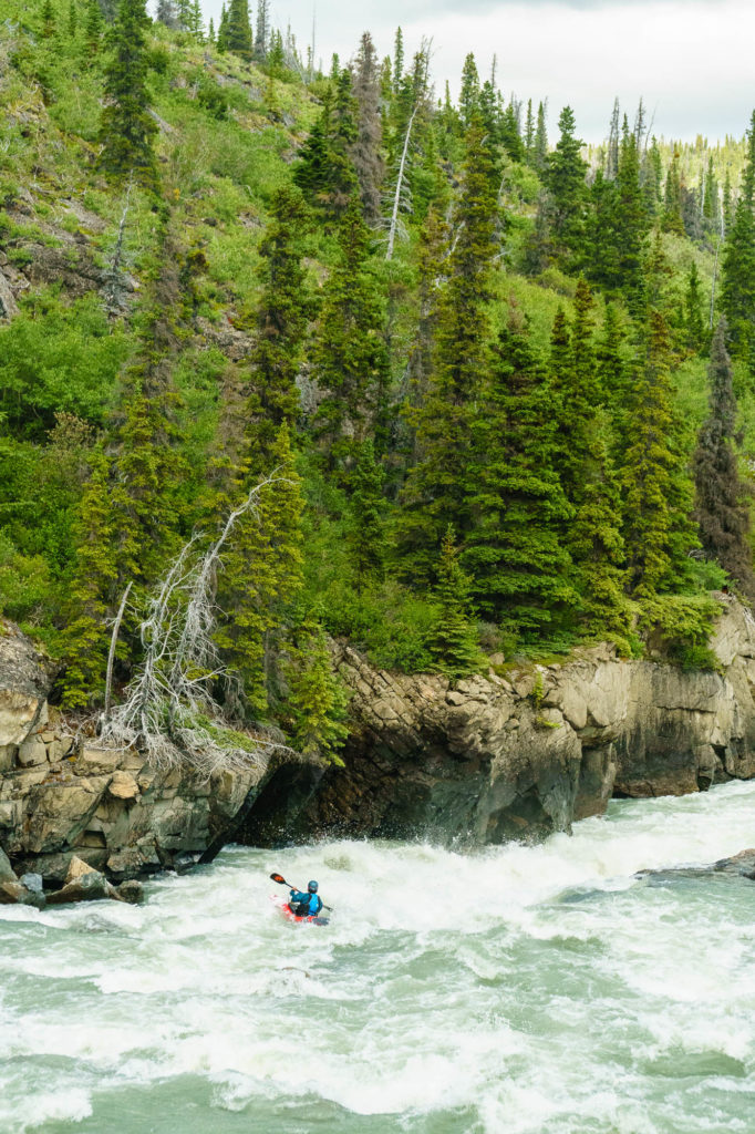 A fun and powerful rapid above a shallow waterfall.